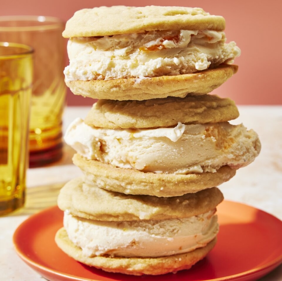 ice cream sandwiches with soft cookies encasing peach and buttermilk ice cream