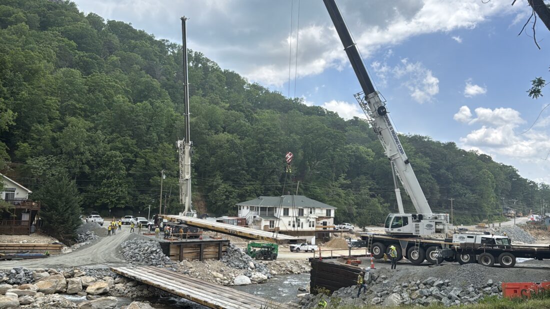 A crane works on a bridge construction