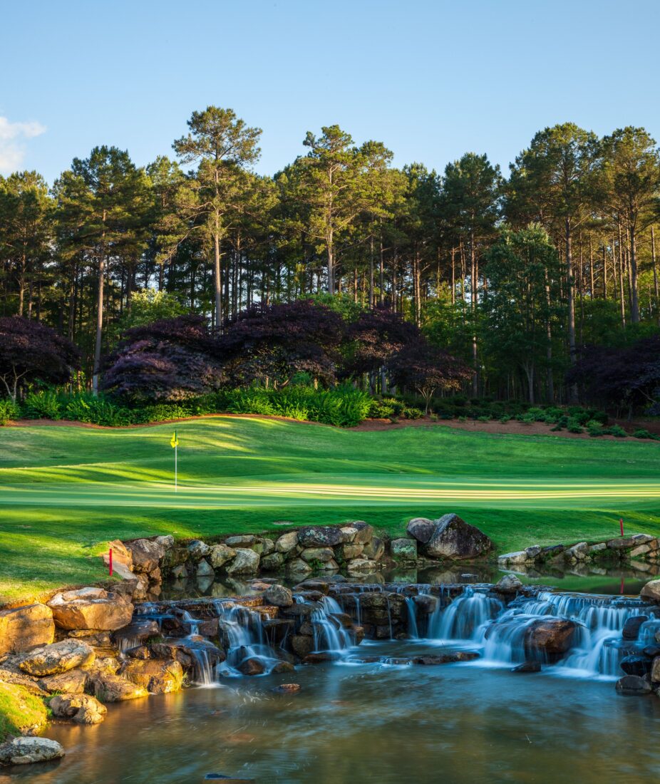 A golf course hole with a waterfall feature