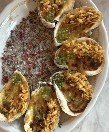 grilled oysters with crab curry and cashews