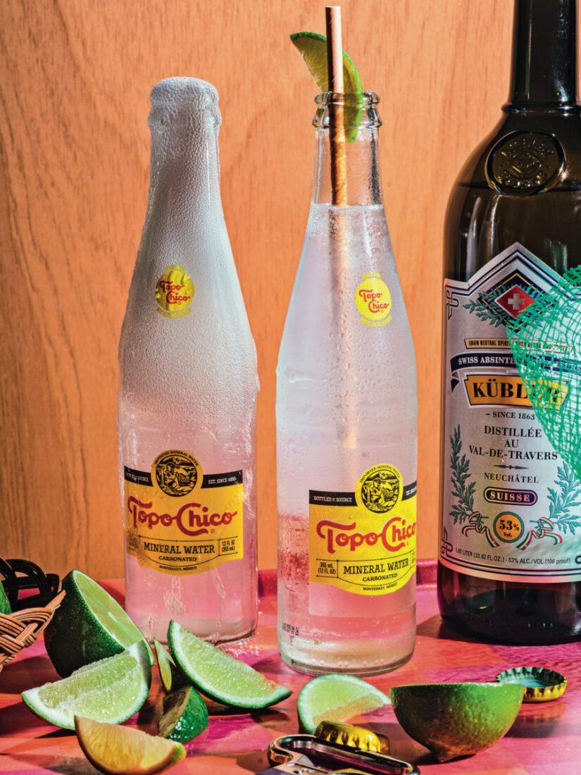 Bottles of topo chico with lime slices