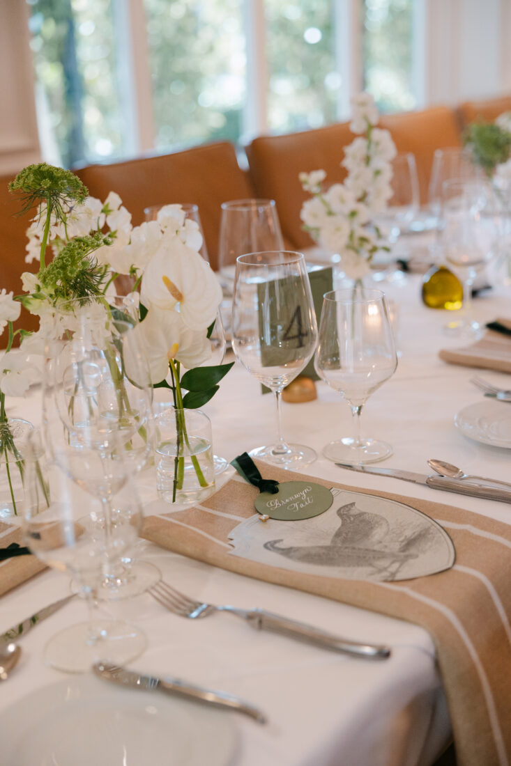 The tables are set with menus and details inspired by the Garden & Gun Club and the Southern sporting lifestyle.