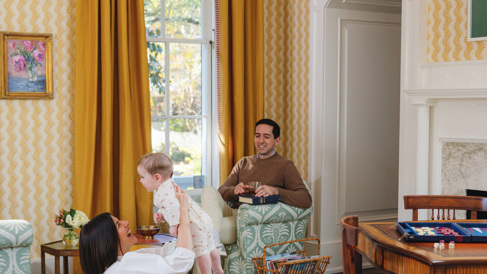 A family sits in a yellow room