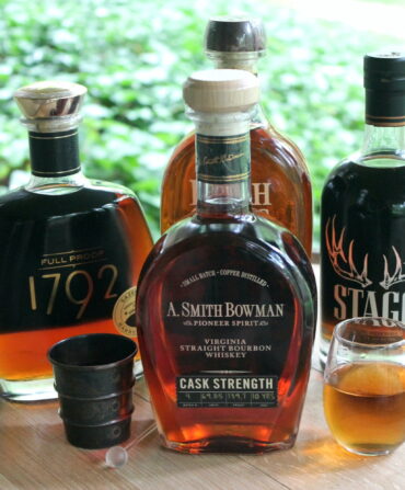 Bottles of bourbon on a cask