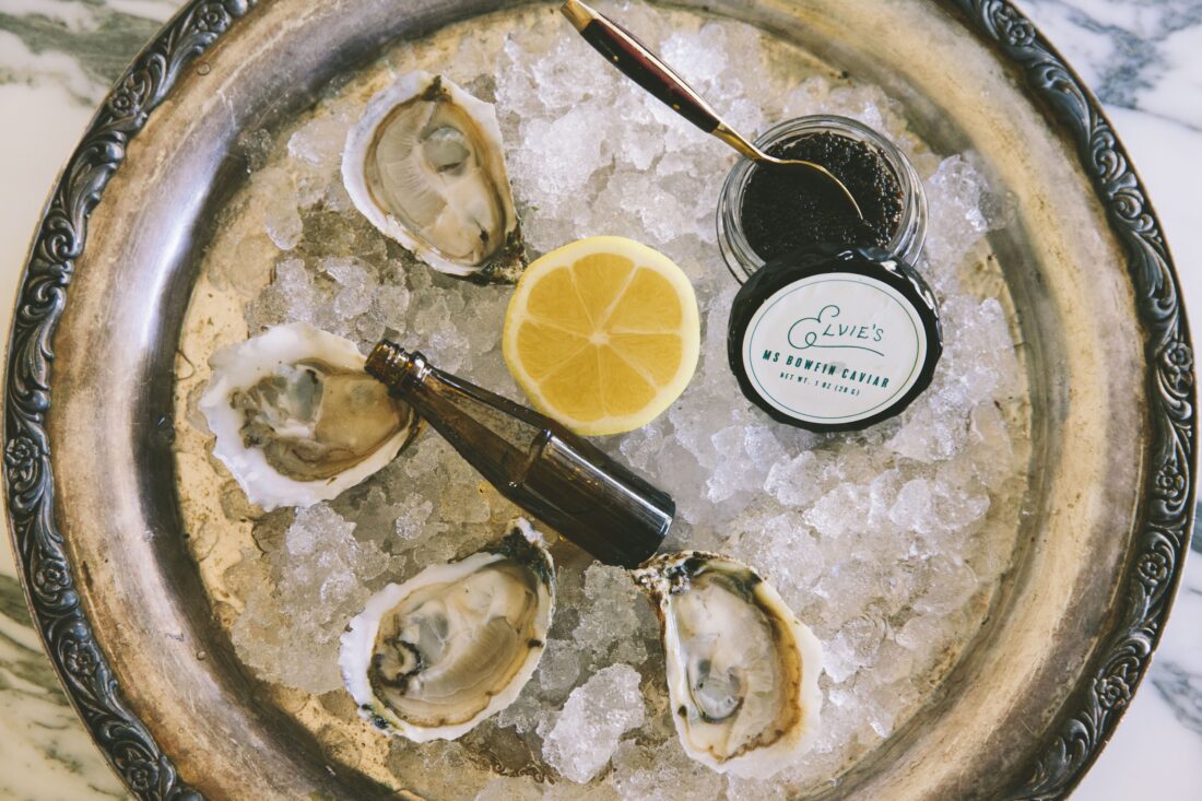 oysters on ice with lemon and caviar