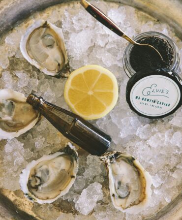 oysters on ice with lemon and caviar