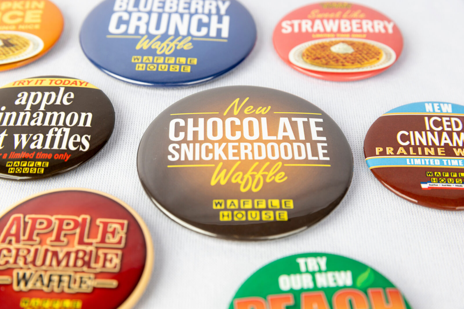 Buttons with waffle house messaging