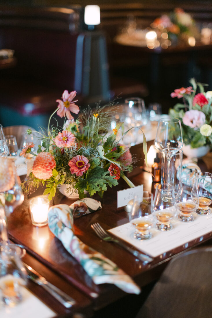 The tables are set for a bourbon tasting with Old Forester distiller Caleb Trigo.