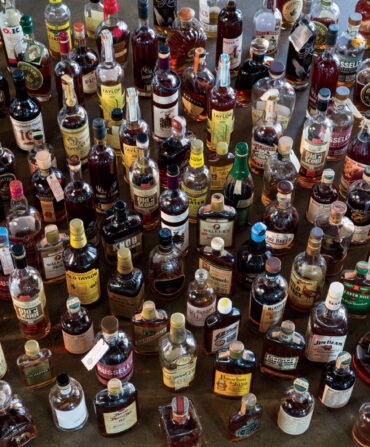 A large number of bourbon bottles