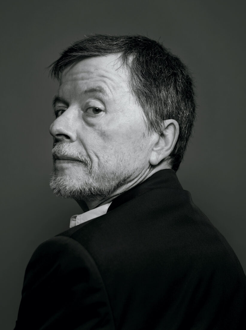 A black and white portrait of Ken Burns