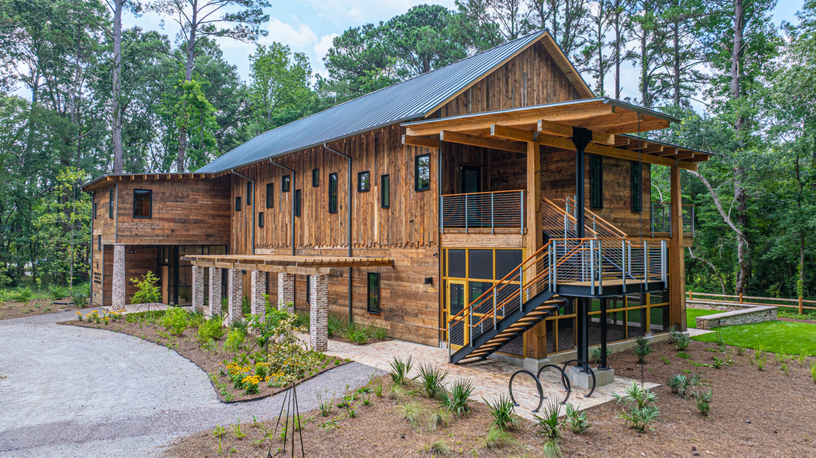 A wood building on a well-landscaped lot