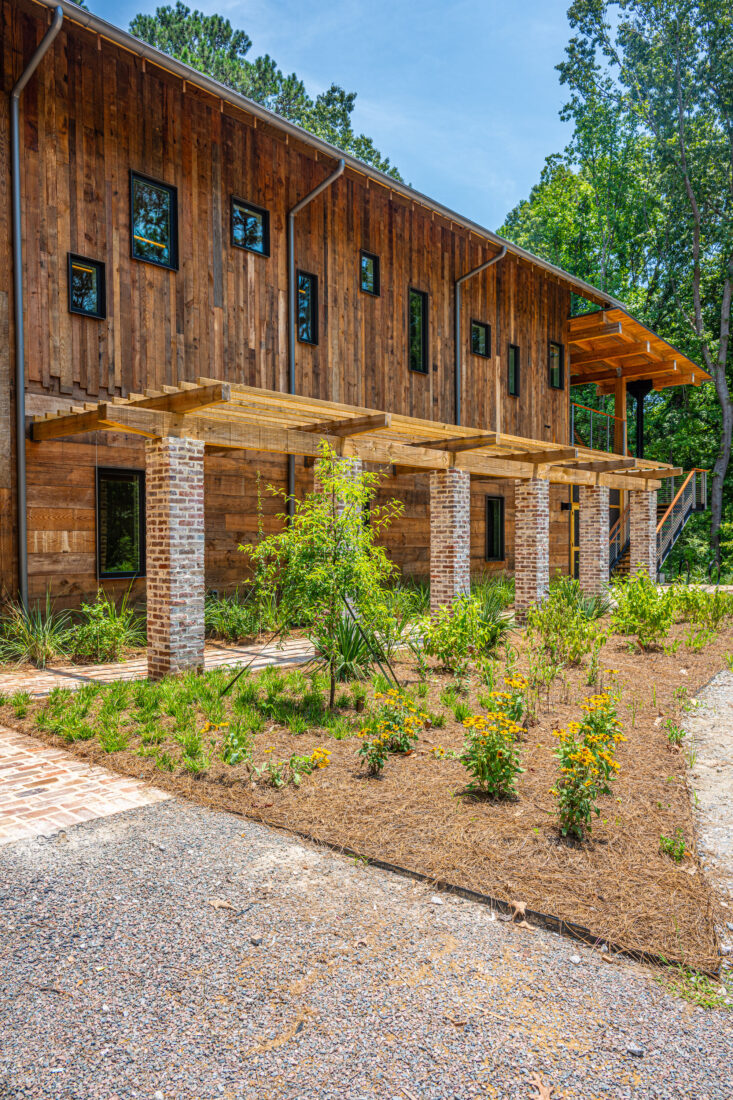 Flowers in bloom outside a wood building