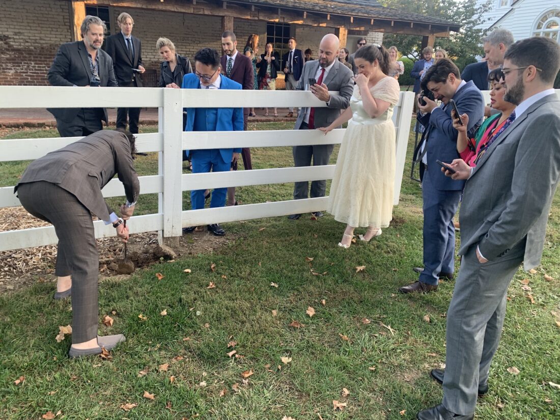 A family buries a bottle of bourbon