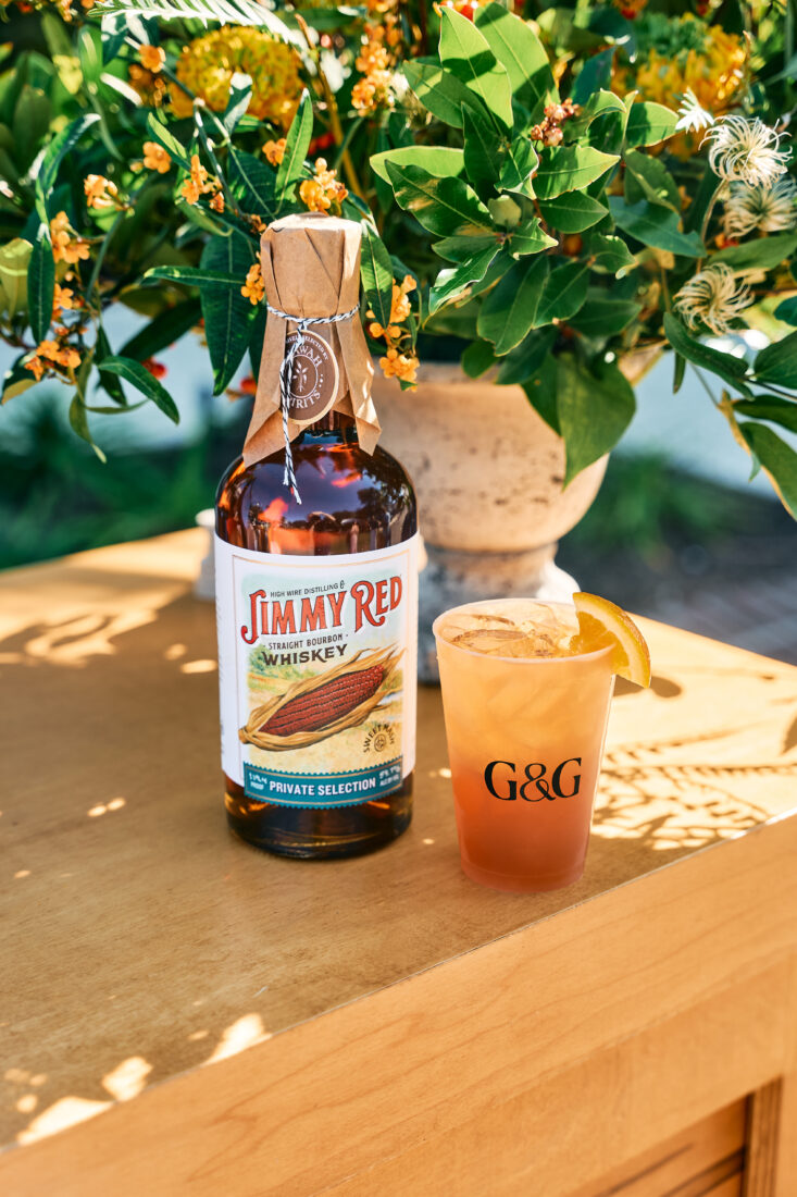 The Sporting Life cocktail, featuring High Wire Distilling Jimmy Red Bourbon Kiawah Spirits Private Selection with berry rooibos, grenadine, and lemon.