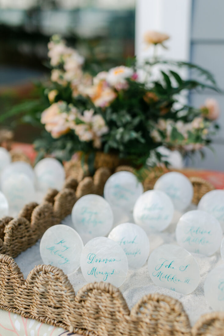 Seashell escort cards await guests.
