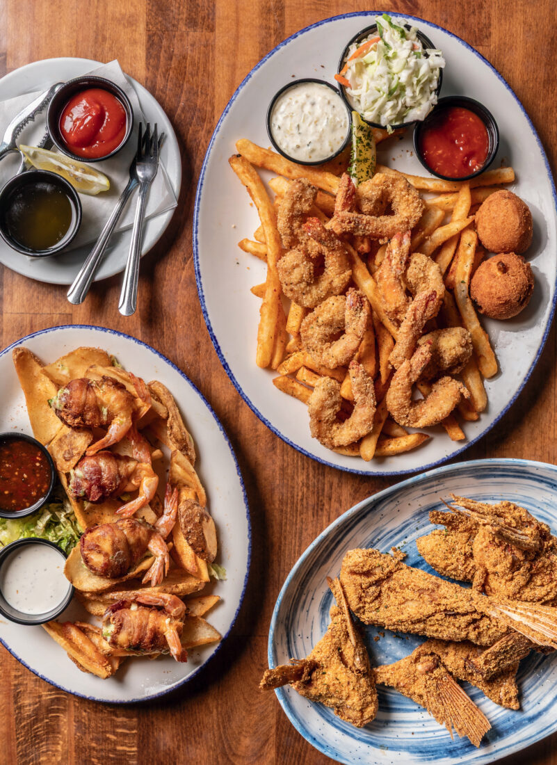 A fried shrimp platter, snapper wings, and a plate of “shrimp frogs”