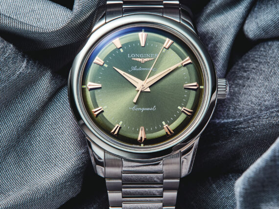 A watch with a green face