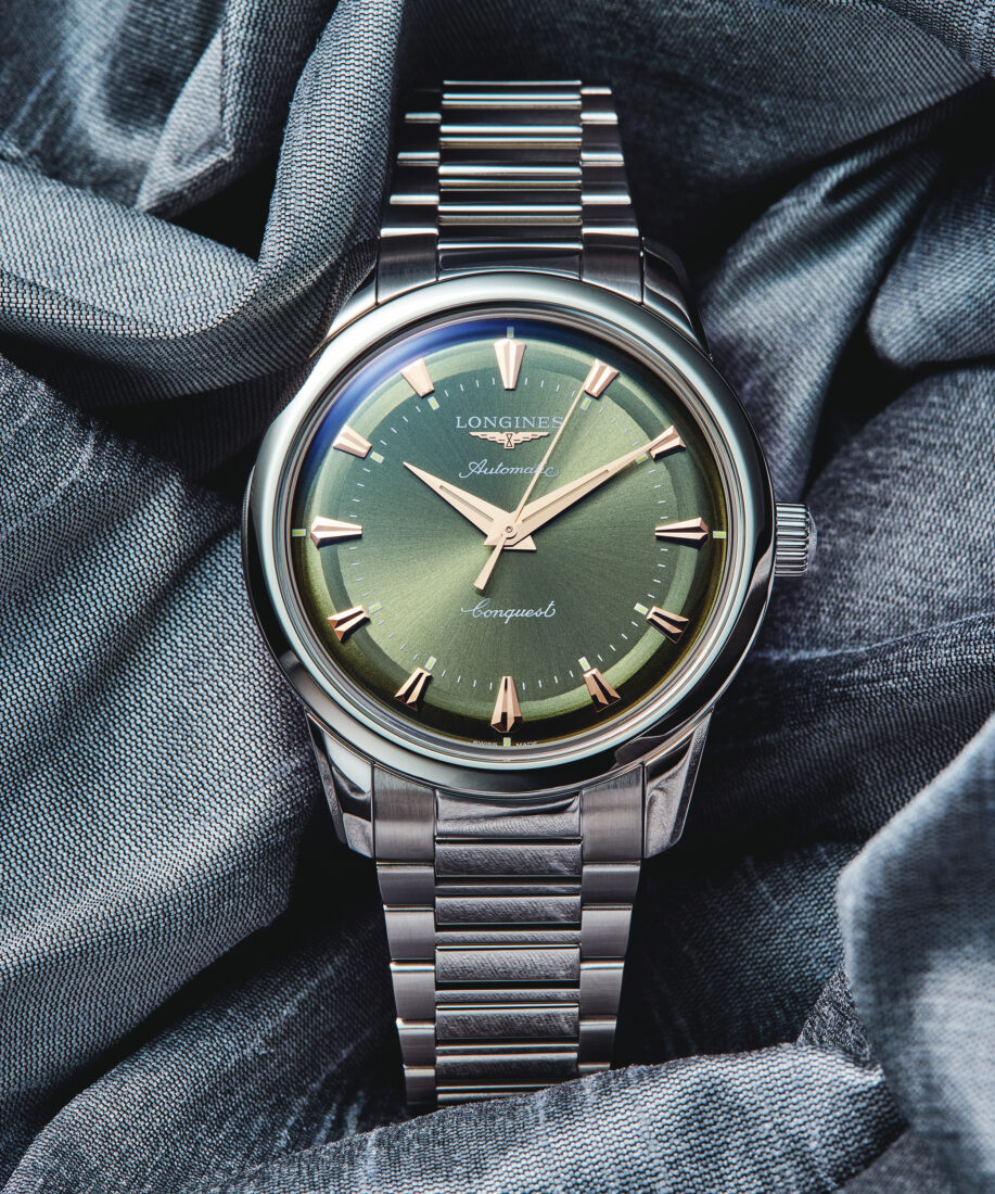 A watch with a green face
