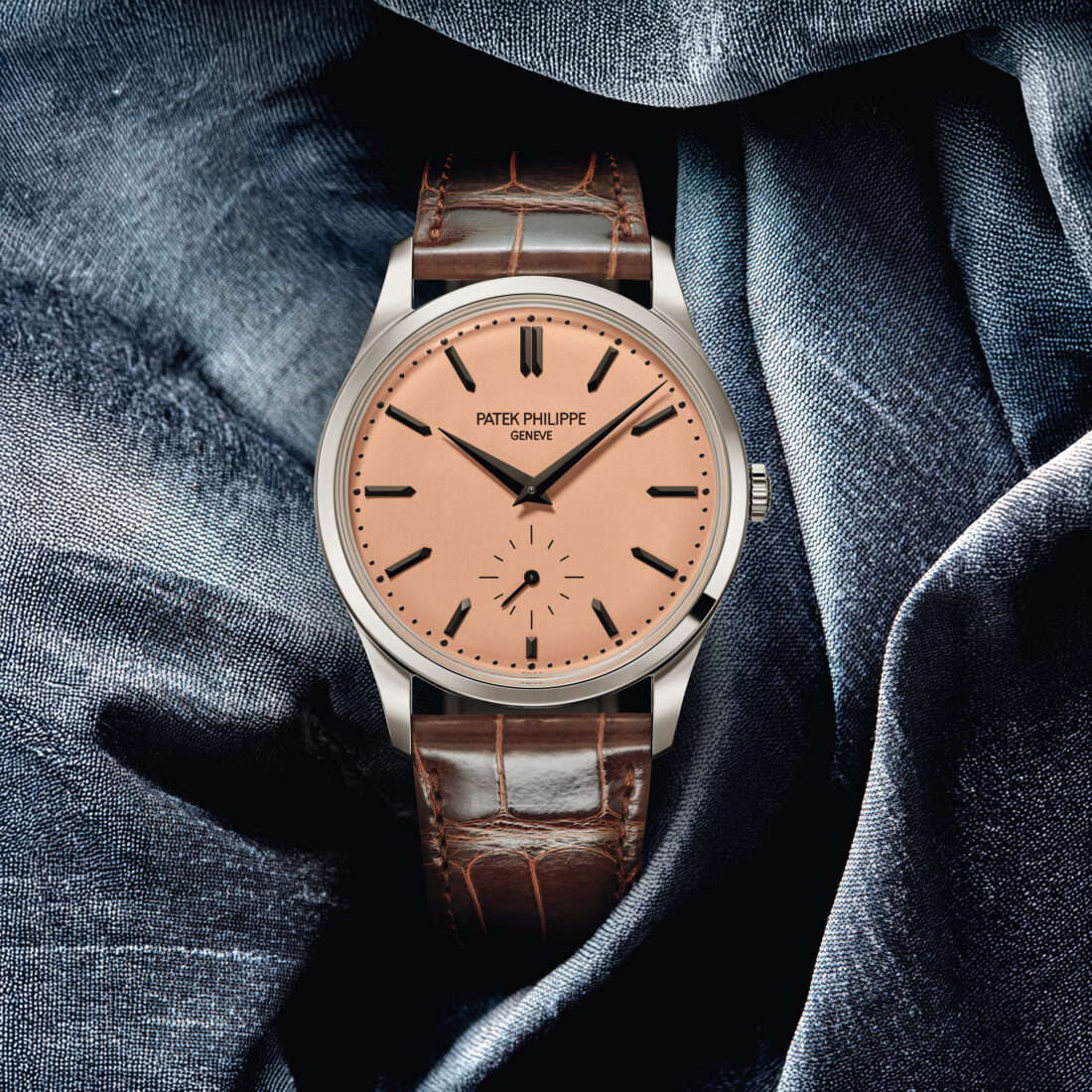 A watch with a rose gold face