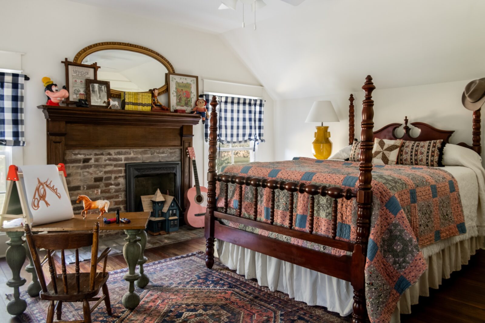 a bedroom with quite and fireplace