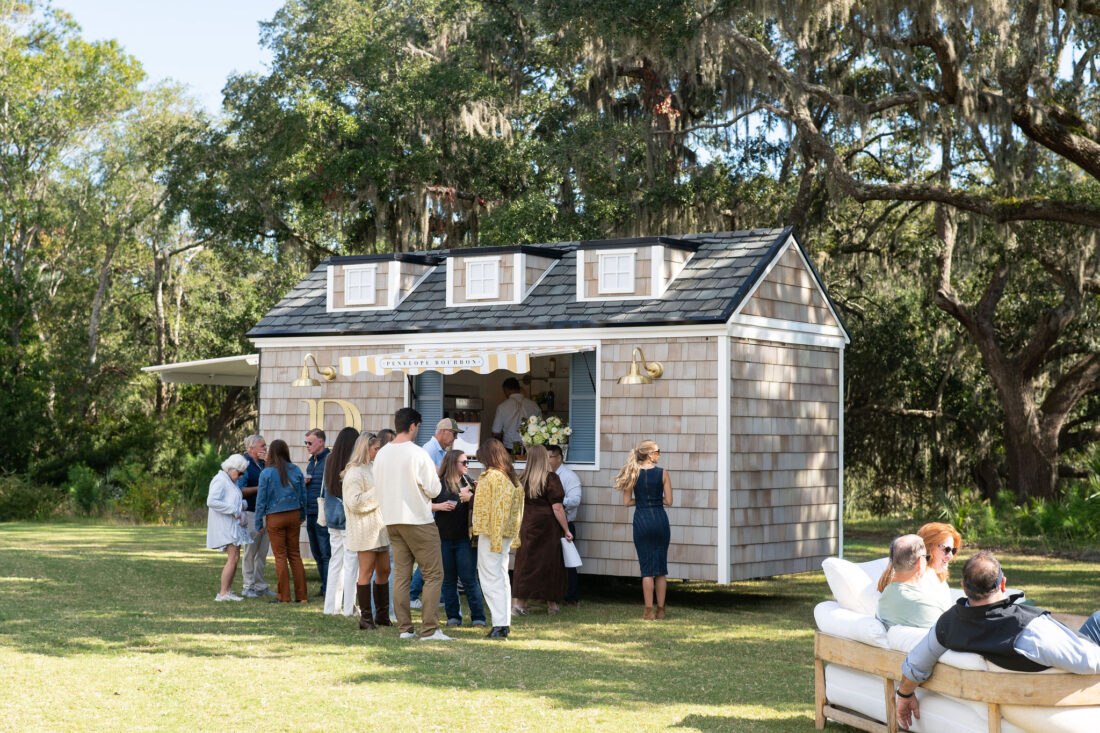 The coastal cottage-inspired Penelope Bourbon Bungalow serves cocktails outside River Barns.