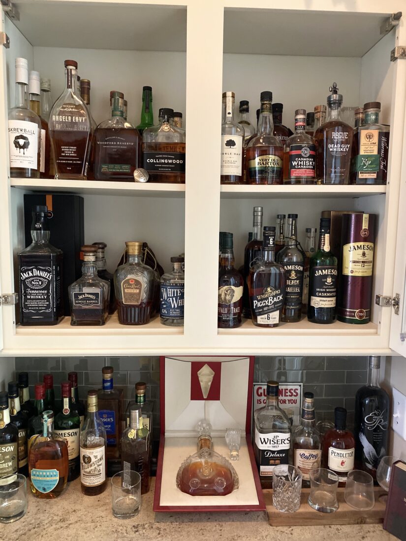 A shelf full of bourbon
