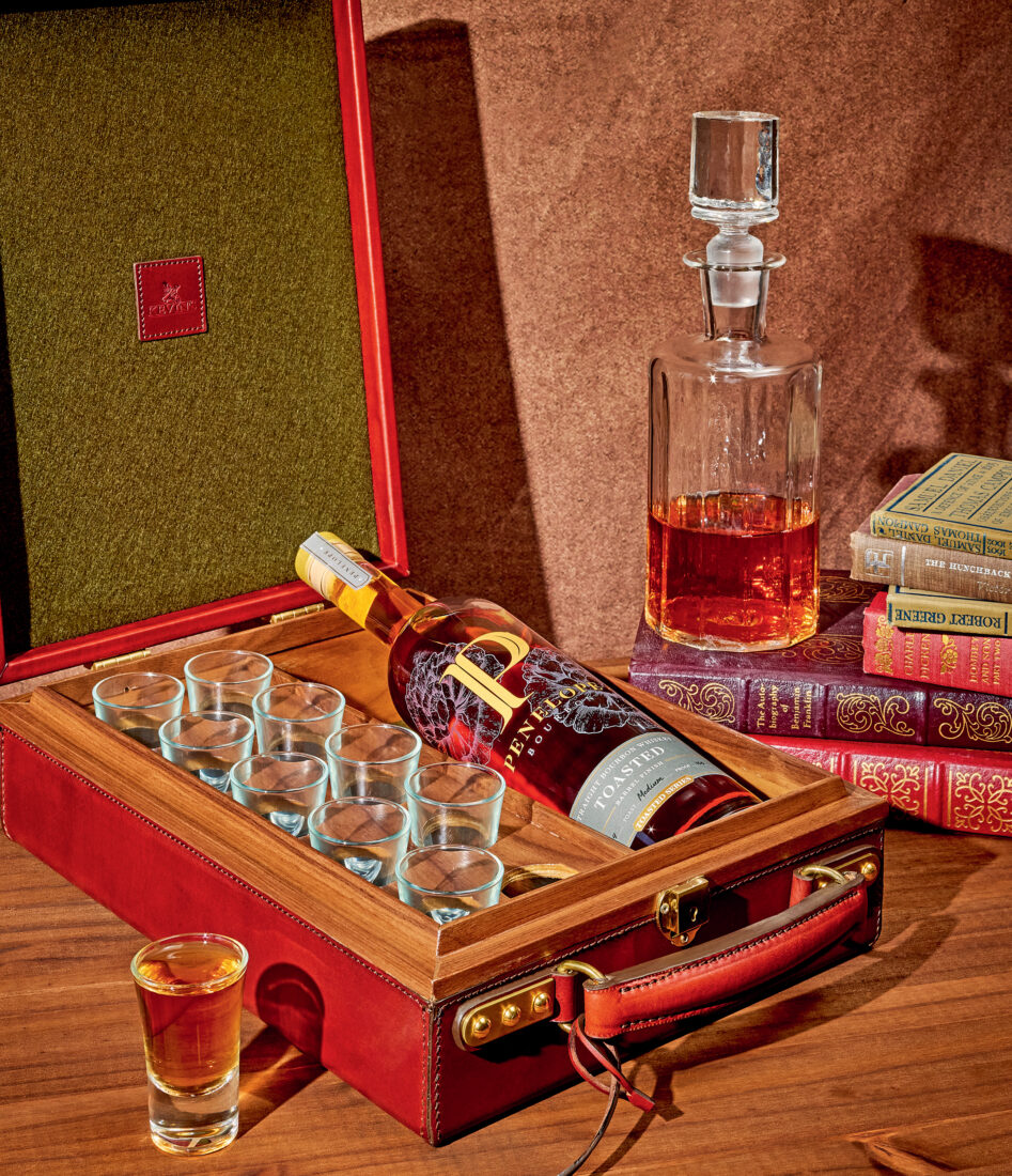 A bottle case with a bourbon decanter