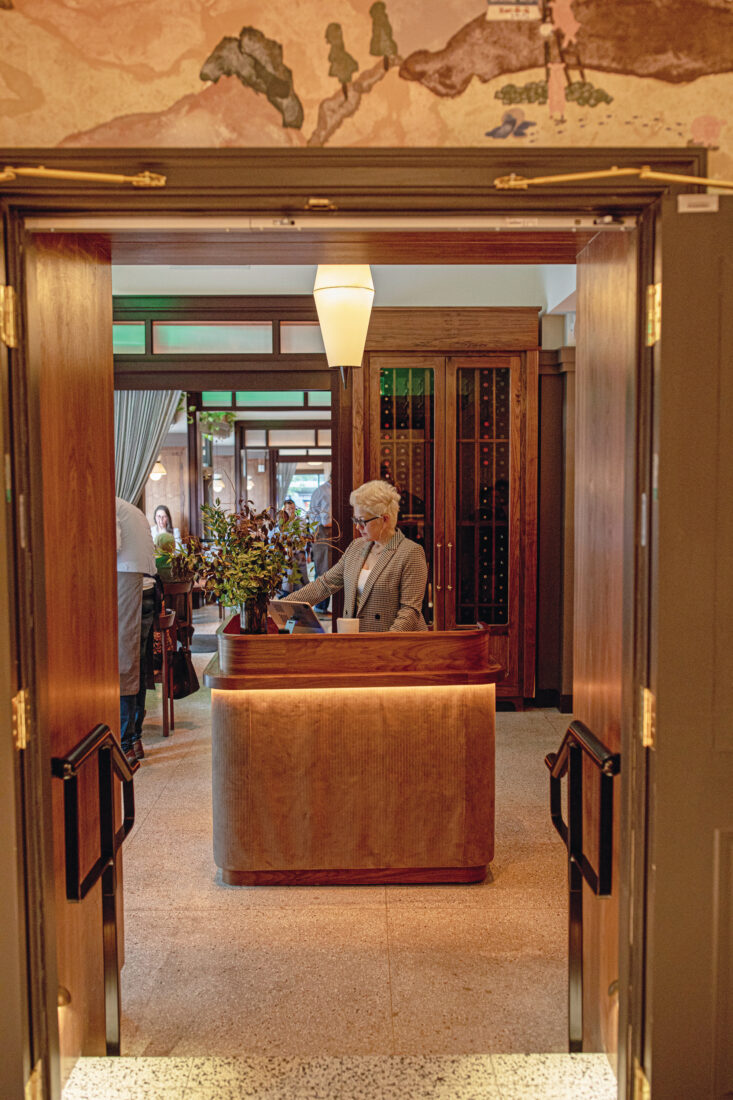 A person at a check-in desk at a restaurant