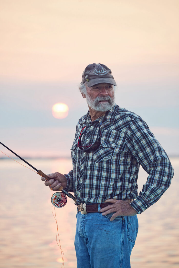 A portrait of a man with a fly rod