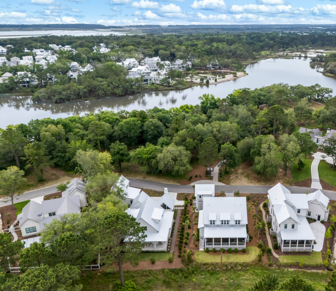 Aerial shot of four homes on the coast of a river bank in the Lowcountry