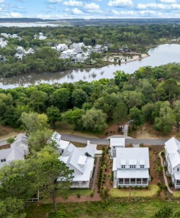Aerial shot of four homes on the coast of a river bank in the Lowcountry