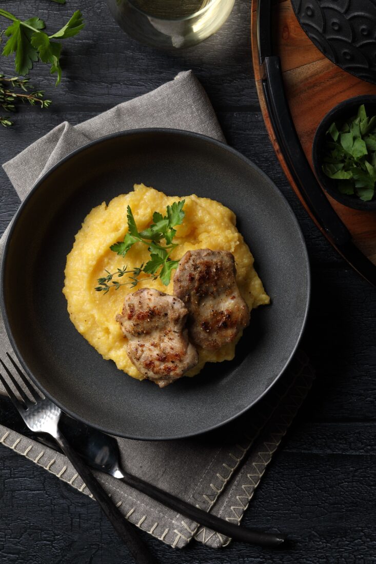 A plate with grits and quail
