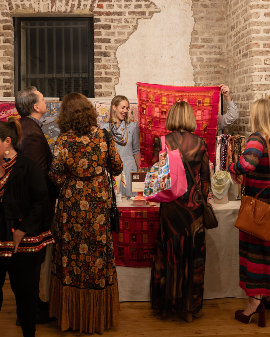 Mississippi-based maker Wells McConnell of Swells speaks with guests about her line of hand-drawn silk scarves.
