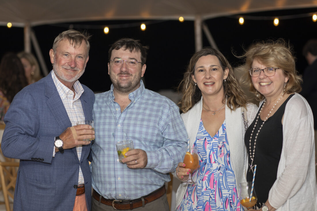 From left: Glenn Horst, Brad Kalota, Diane Kalota, and Vicki Horst toast Southern Swizzle cocktails before dinner.