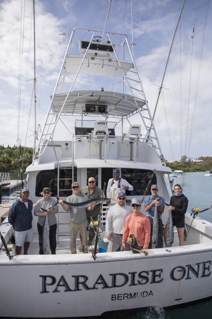 Guests celebrate their bounty with the crew of Paradise One.