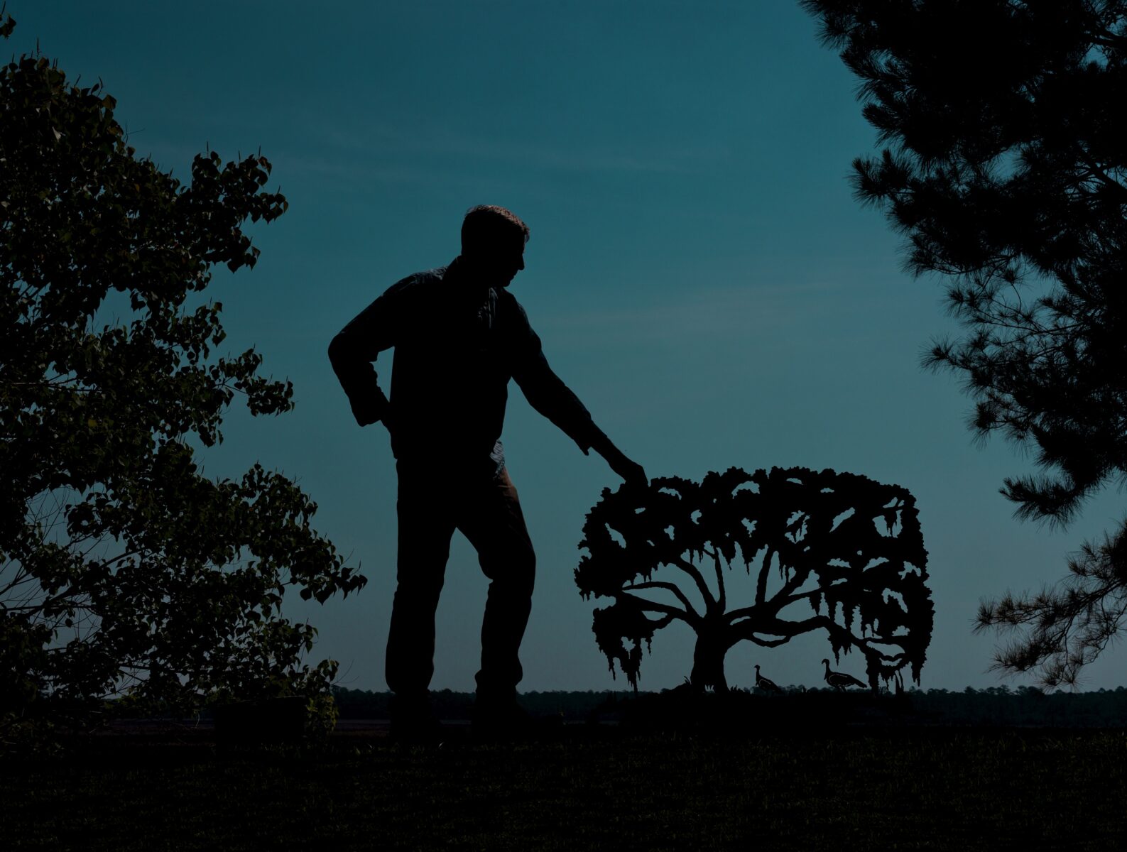 Clay Rice with a metal sculpture