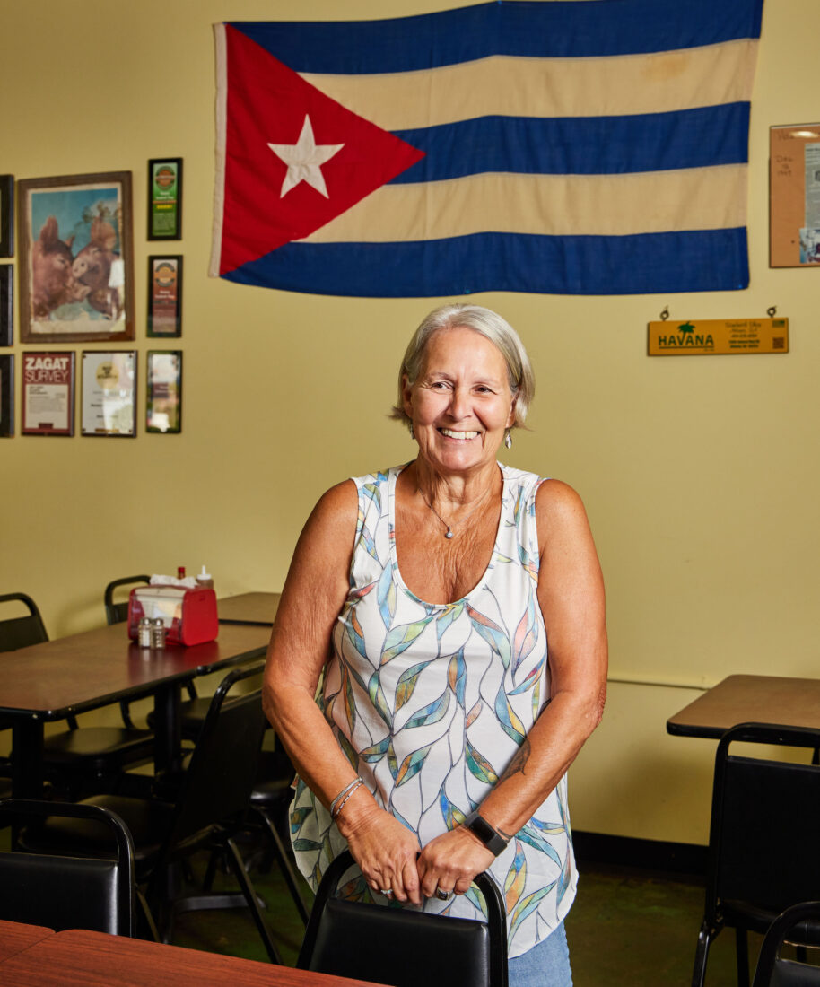 A portrait of a woman inside a restaurant
