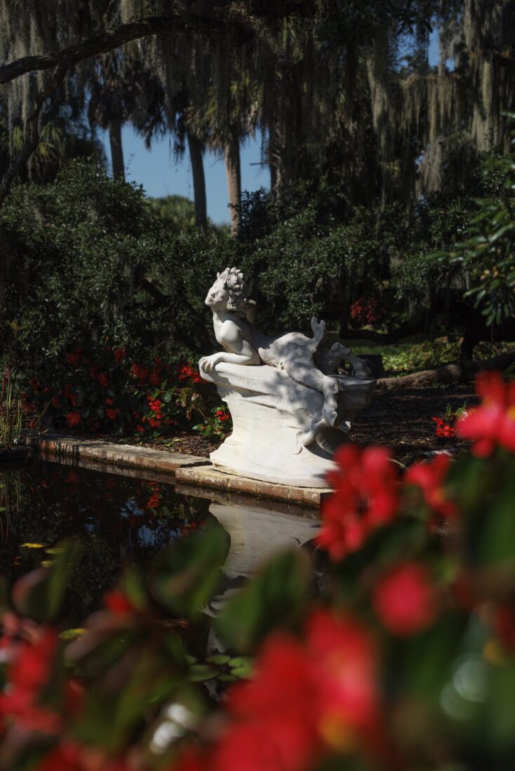 a statue in a garden