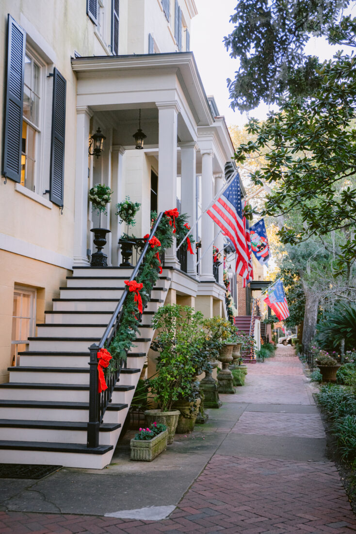 A line of historic homes decorated for the holidays