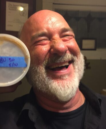 A portrait of a man with a tub of gumbo