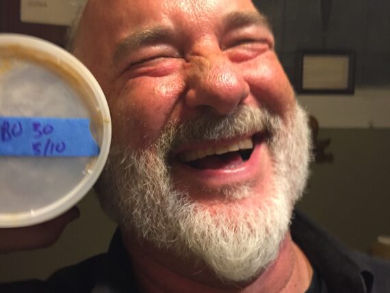 A portrait of a man with a tub of gumbo