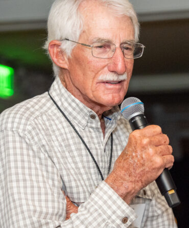 A man holds a microphone