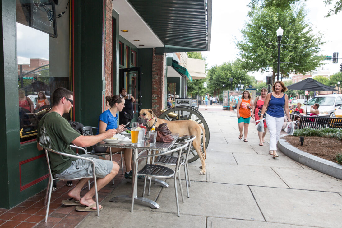 People eating outside downtown