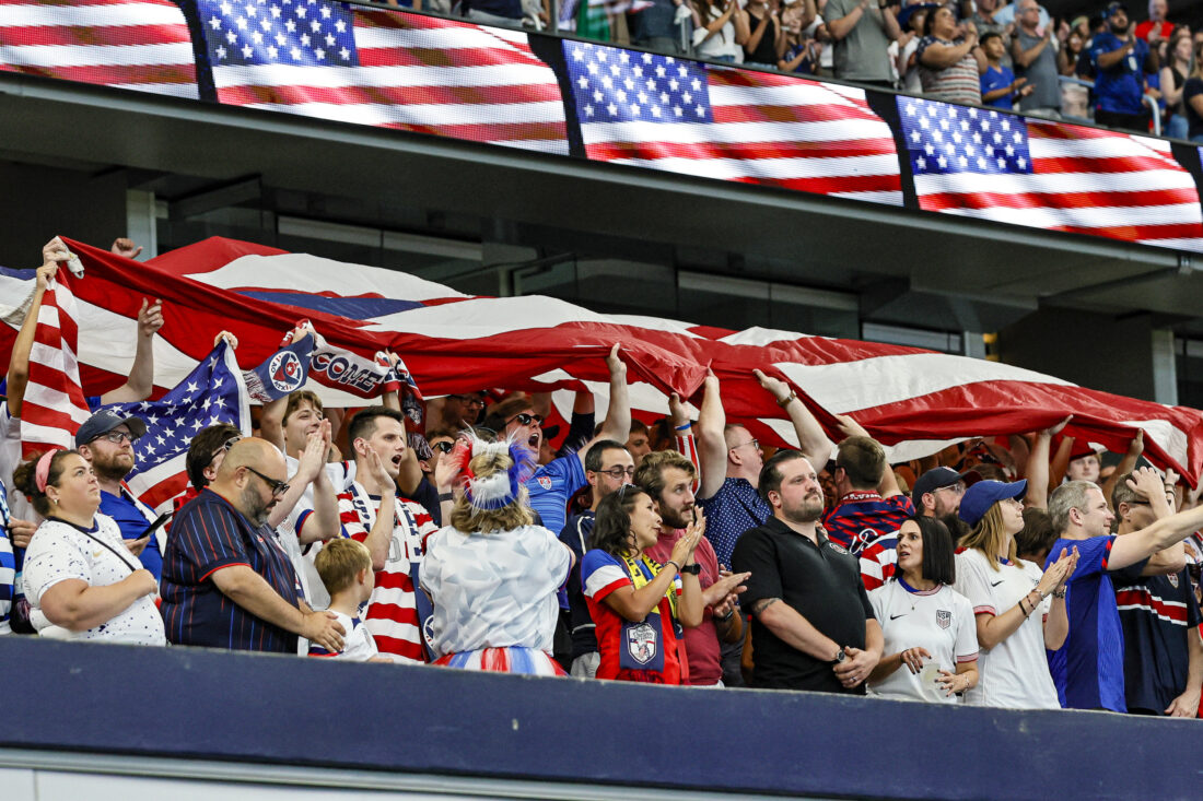 Soccer fans celebrate a win