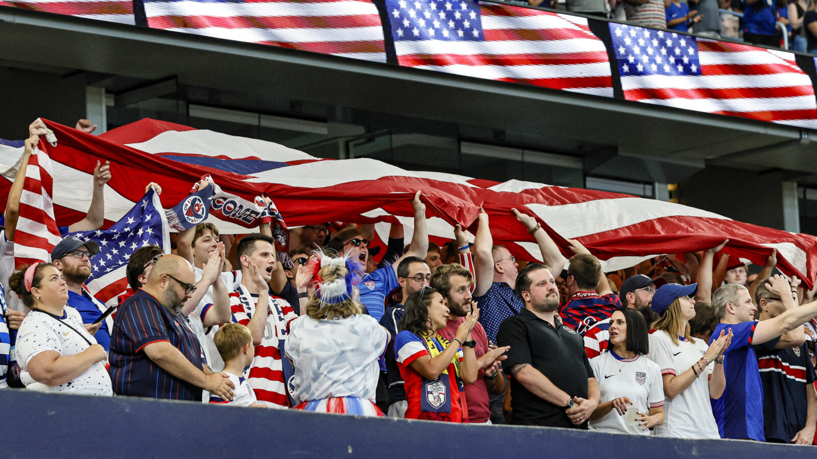 Soccer fans celebrate a win