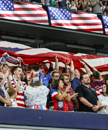 Soccer fans celebrate a win