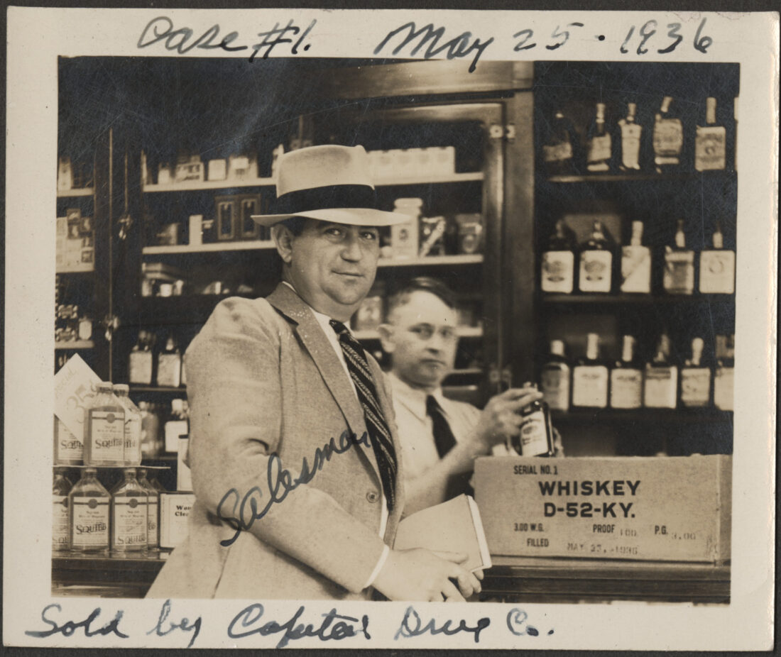 A bourbon salesman by a box