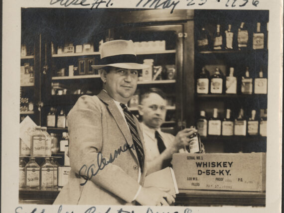 A bourbon salesman by a box