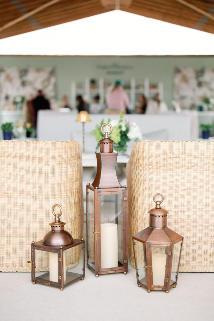 Copper lanterns by Bevolo Gas & Electric Lights complement the space.