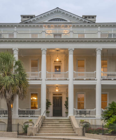 Outside a white mansion hotel